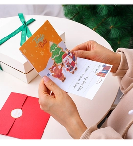 Close-up detail of a creative 3D pop-up Christmas greeting card featuring a festive tree design.