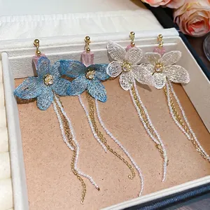 Handmade knitted flower earrings with crystal tassels and silver needle in light blue and white