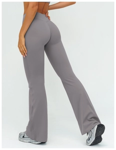 Detail view of high-waisted flared yoga pants in dark grey with butt-lifting effect