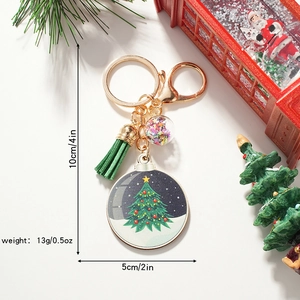 Christmas tree keychain with green tassel and round pendant measuring 10cm by 5cm