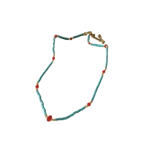 Bohemian beaded necklace with turquoise tubes, red beads, and gold spacers for women