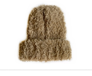 Close-up of the fluffy brown plush texture of this warm autumn winter knitted beanie