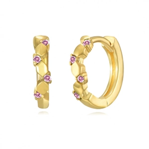 Detailed macro view of golden hoop earrings featuring vibrant pink inlaid crystals