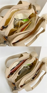 Internal compartments of the beige nylon tote showing multiple pockets and spacious storage