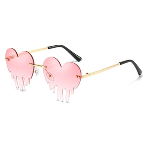 Fashion heart shaped sunglasses with pink melting drip lenses and gold metal frames