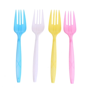 Close-up of colorful disposable plastic forks in blue white yellow and pink for party use