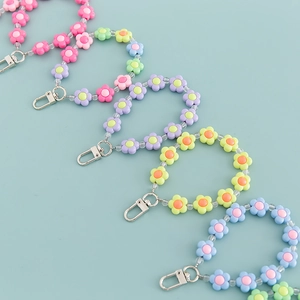 Set of five colorful acrylic flower bead keychains with metal lobster clasps for bags