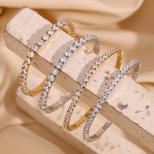 Classic 18K gold plated tennis bracelets featuring shimmering round cubic zirconia stones