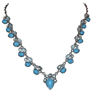 Vintage bohemian V-shaped necklace with oval turquoise stones and crystal accents