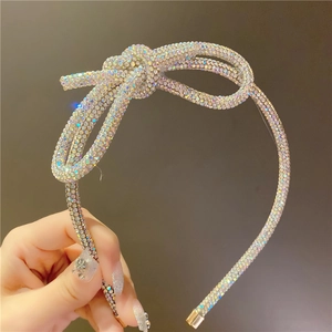 Detailed view of handmade sparkling rhinestone bow headband with colorful crystals