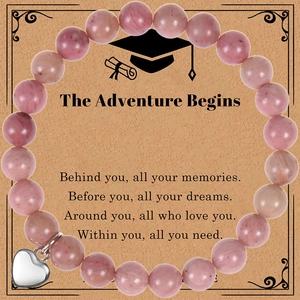 Pink and purple natural stone beaded bracelet with heart charm on a graduation gift card
