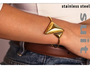 Detailed view of 18K gold plated stainless steel bracelet with geometric triangle design