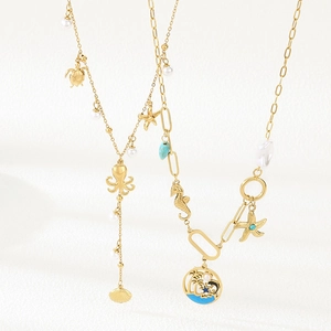 Gold ocean charms necklace with starfish, turtle, pearls and turquoise for summer beach vacation