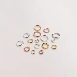 Close-up of 18K gold plated jump rings in various sizes and metallic finishes for DIY jewelry