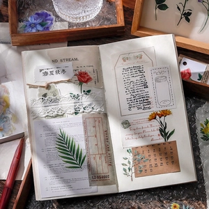 Vintage floral scrapbooking stickers and botanical collage on notebook pages