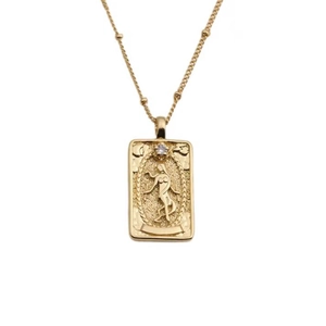 Gold rectangular pendant necklace with embossed female figure and clear zircon stone