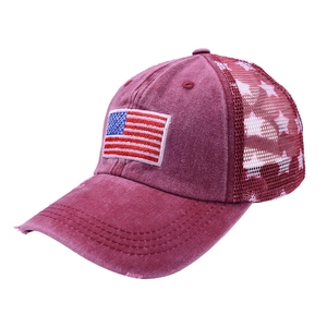 Detail of burgundy vintage trucker hat with US flag patch and mesh star pattern