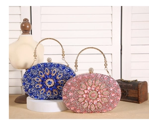 Detail of luxury royal blue and pink sunflower evening bags with radiant rhinestones