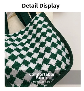 Detail view of green and white houndstooth knit fabric texture on the shoulder bag
