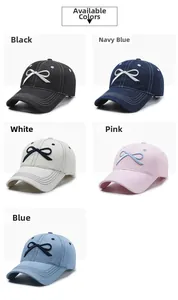 Detail view of denim baseball caps in five colors with bow embroidery and stitching