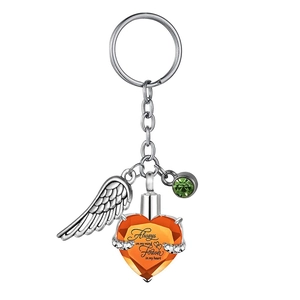 Heart-shaped urn keychain with angel wings and orange crystal for pet memorial