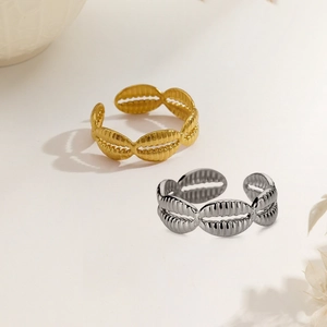 Set of two adjustable shell-inspired ribbed stainless steel rings in gold and silver