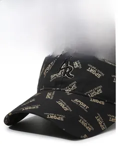 Close-up of black baseball cap featuring 3D R-letter embroidery and gold sport patterns