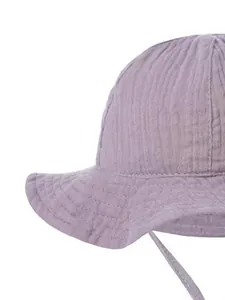 Close-up of purple baby sun hat made of soft wrinkled cotton gauze with chin strap