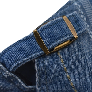 Classic blue denim beret with vintage bronze buckle and adjustable strap detail