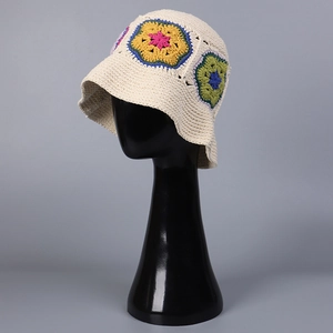 Handmade crochet bucket hat in beige cotton with vibrant floral patchwork patterns