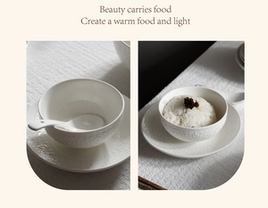 Detailed relief patterns on white ceramic dinnerware set including a bowl and saucer