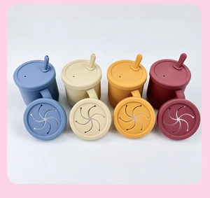 Detailed view of 4-color baby silicone cups with straw lids and snack covers
