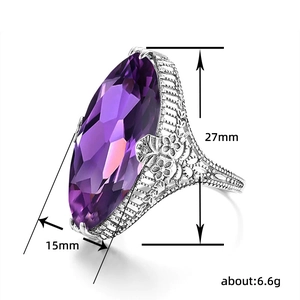 Vintage ring met marquise paarse edelsteen en zilveren filigraan bloemendetails