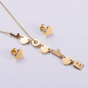 Golden LOVE letter and heart jewelry set featuring a necklace with matching stud earrings