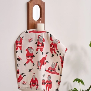 Cream Santa Claus print Christmas dinner napkins on a vintage wooden mirror frame