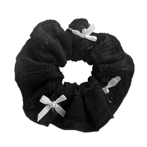 Black lace hair scrunchie with three white bows and pearl accents on white background