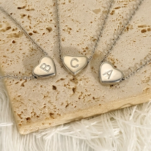 Polished stainless steel heart initial necklaces with A, B, C letters on stone base