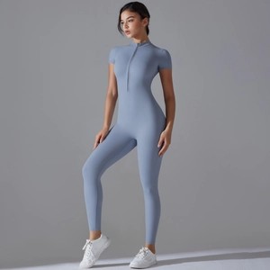 Close-up of moisture-wicking yoga jumpsuit with front half-zip and stand-up collar