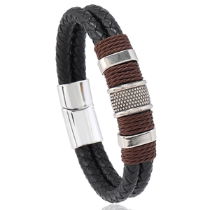 Close-up of double-layer braided black leather bracelet with silver magnetic buckle