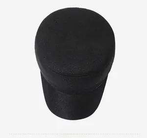 Overhead view of a black flat top winter cap with thick thermal fleece lining texture