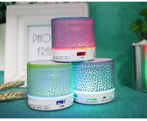 Detail view of mini crackle Bluetooth speakers showing USB ports and control buttons