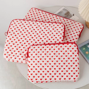 Three-piece set of quilted heart pattern iPad and laptop sleeves in various sizes