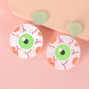 Detail of Halloween eye earrings with translucent green discs and red vein patterns