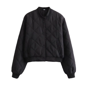 Detail of black quilted bomber jacket with diamond pattern and snap button closure