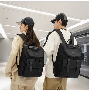 Lighweight black nylon backpack for men and women shown on models in daily life