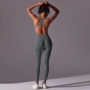Detail of seamless dark gray backless yoga jumpsuit featuring racerback and snug fit