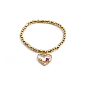 Bracelet doré à perles élastique avec pendentif cœur rouge et inscription LOVE en cristaux