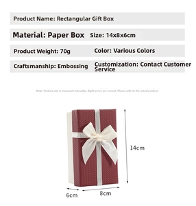 Detailed view of burgundy embossed gift box with beige bow and 14x8x6cm size markings