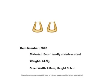 Detailed view of gold U-shaped chunky hoops with 3.2cm height and 2.8cm width dimensions