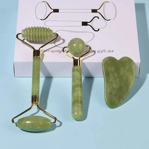 Three-piece green jade facial massage set with rollers and heart-shaped gua sha tool